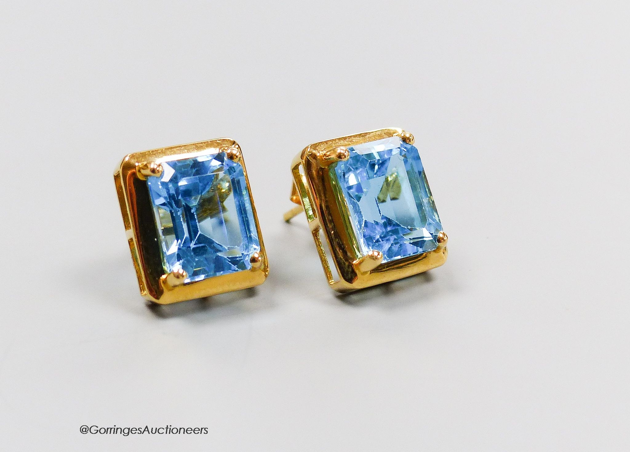 A pair of 18ct gold and topaz earrings, gross 4g.